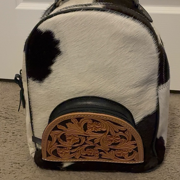 backpacks with leather accents Western Genuine cow hide backpack w/ tooling & cherry Shop Southern Charm The backpacks adjustable leather shoulder straps and carry handle ensure comfort and ease of carrying Large Capacity Vintage Canvas Waterproof